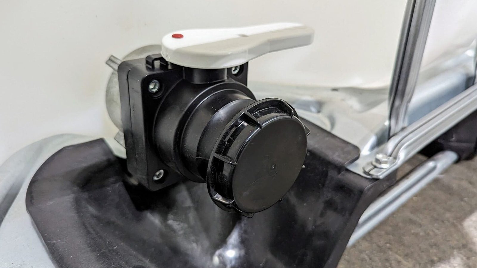Close-up of an IBC tote valve with camlock outlet