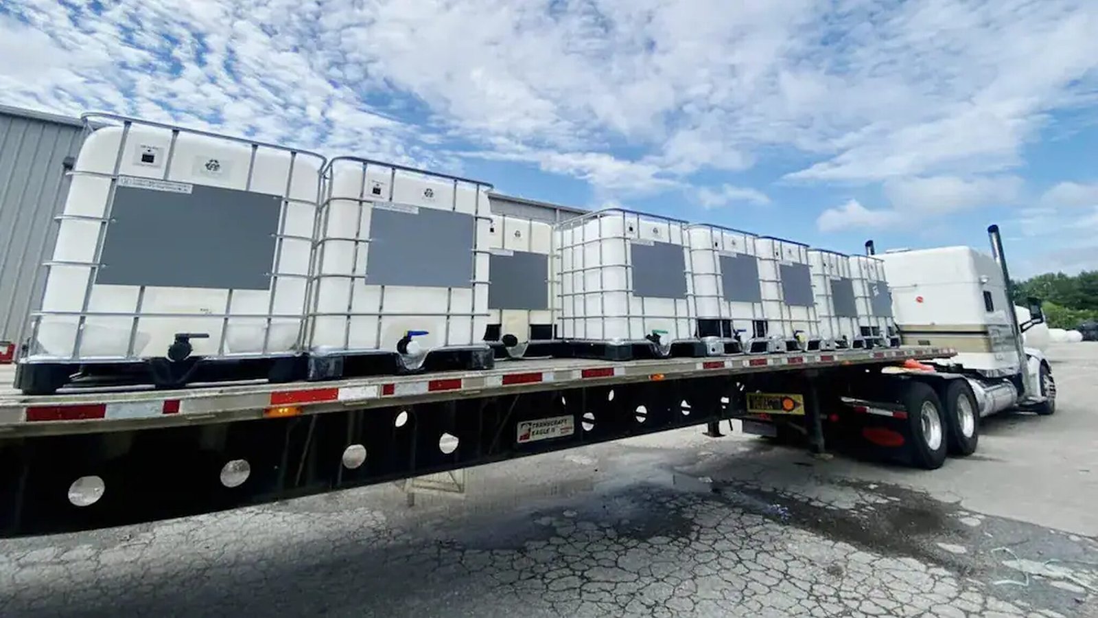 IBC water tanks loaded on a truck