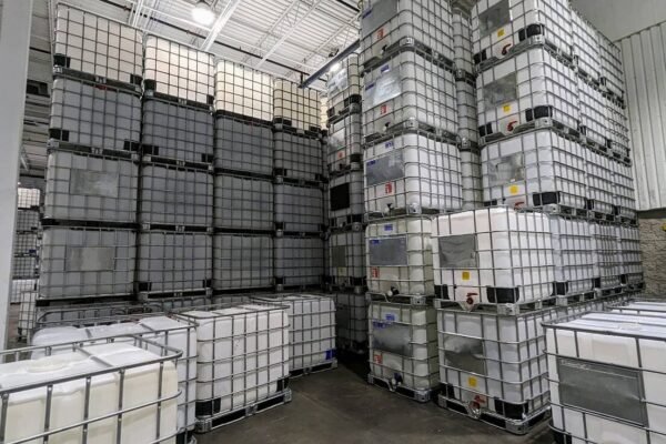 Warehouse filled with stacked 1000 litre IBC totes